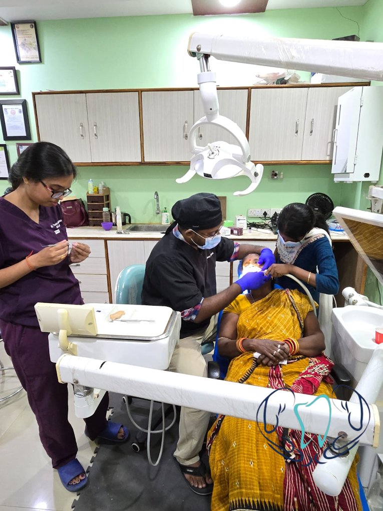 Dentist examining patient's teeth